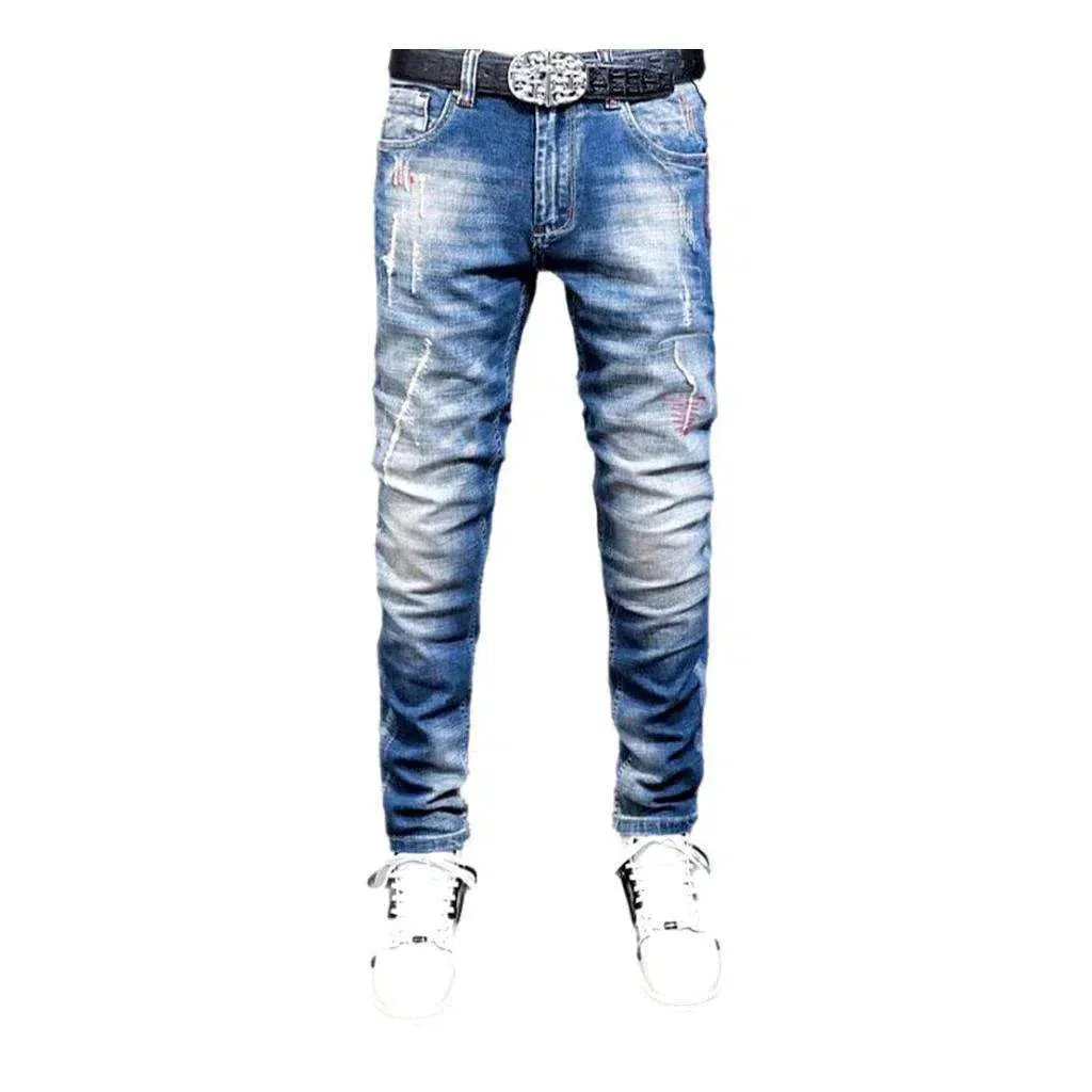 Sanded men's whiskered jeans