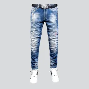 Sanded men's whiskered jeans